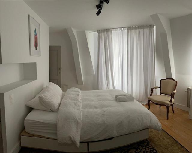 Duplex dernier étage avec terasse à deux pas de la grand place
