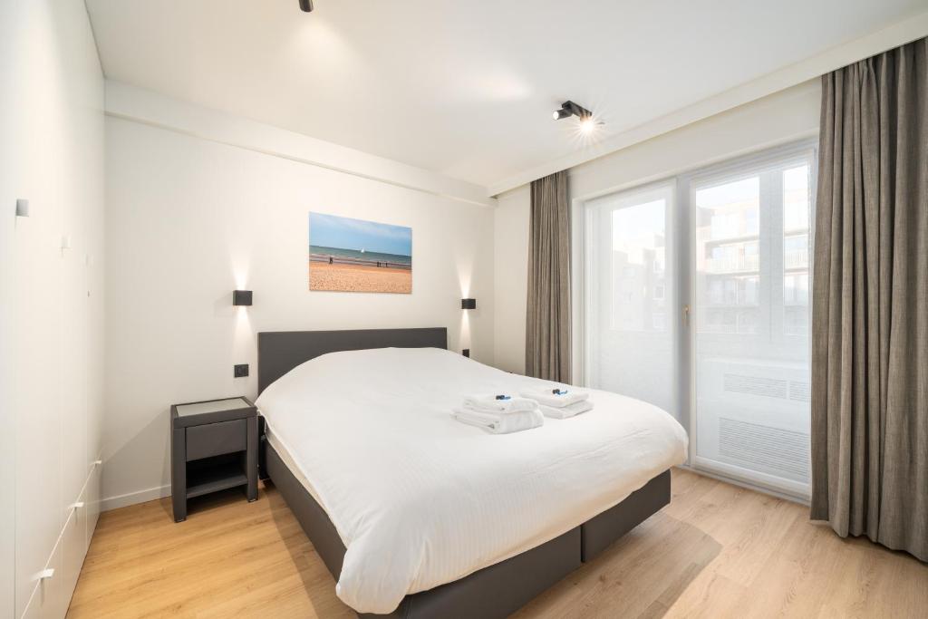 Luxe comfort app met zijdelings zeezicht en in centrum